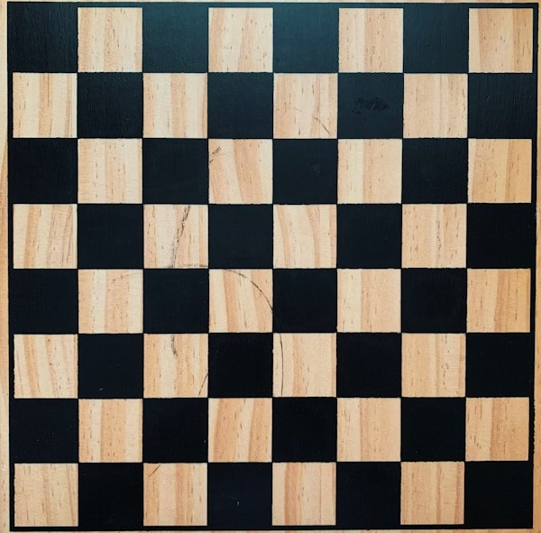 Checkered chess board with wooden frame